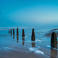 Buy canvas prints of Weathered beach groynes at Dawn by Tony Twyman
