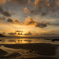 Buy canvas prints of Golden sunset reflections at Westward Ho by Tony Twyman