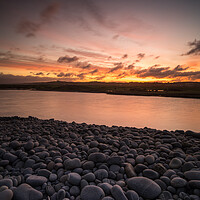 Buy canvas prints of Sunrise on the Pebbles by Tony Twyman