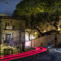 Buy canvas prints of The Rua do Salvador street and light tails at nigh by RUBEN RAMOS