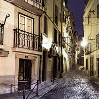 Buy canvas prints of A narrow stone street empty in Lisbon. by RUBEN RAMOS