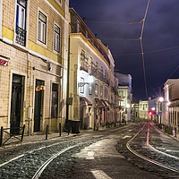 Buy canvas prints of An old stone street in Lisbon at night. by RUBEN RAMOS