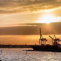 Buy canvas prints of Ships and cranes silhouettes at the Melbourne Port by RUBEN RAMOS