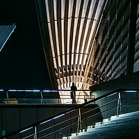 Buy canvas prints of Silhouette of a man standing under roof, Sydney.  by RUBEN RAMOS