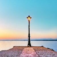 Buy canvas prints of Old Vintage Lantern over sea at sunset. by RUBEN RAMOS