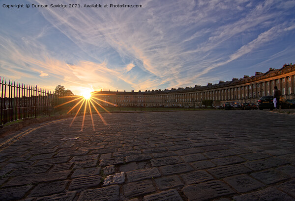 sun star over the cobbles of Bath's Royal Crescent Picture Board by Duncan Savidge