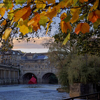 Buy canvas prints of Pulteney Bridge and weir Autumn with sinking houses by Duncan Savidge
