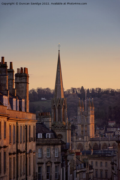Winter sun hitting the Bath Abbey and surrounding sky line Picture Board by Duncan Savidge