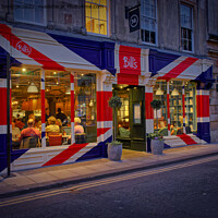 Buy canvas prints of Bill's restaurant at dusk decorated in the Great Britain flag  by Duncan Savidge