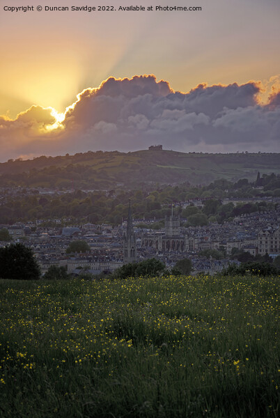 The sun setting behind a cloud over Bath Picture Board by Duncan Savidge