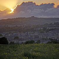 Buy canvas prints of The sun setting behind a cloud over Bath by Duncan Savidge
