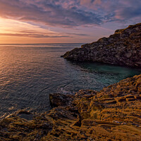 Buy canvas prints of Sunrise on the rocks at Maenporth, South Cornwall by Duncan Savidge