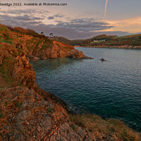 Buy canvas prints of Looking back to Maenporth sunset light by Duncan Savidge