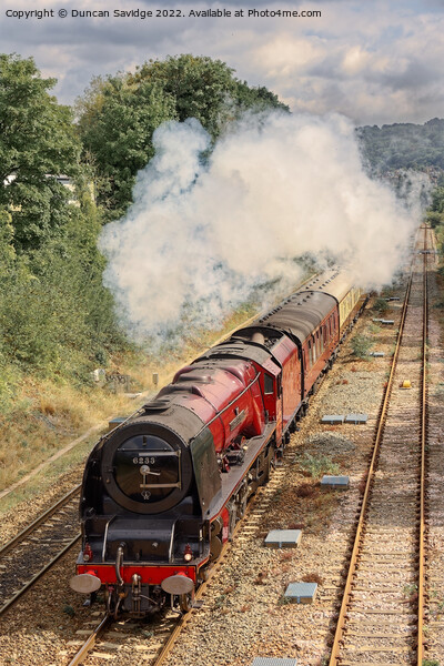 Duchess of Sutherland blasts out of Bath on a sunny early Autumn day Picture Board by Duncan Savidge