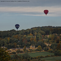 Buy canvas prints of Two hot air balloons coming into land at Sham Castle in Bath by Duncan Savidge