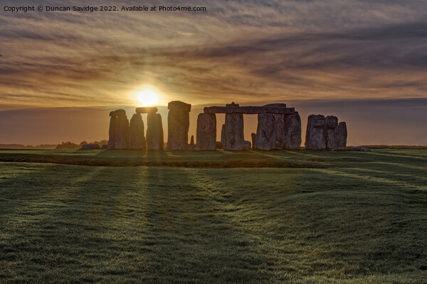 Stonehenge Winter Sunset sun stripes  Picture Board by Duncan Savidge