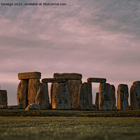 Buy canvas prints of Stonehenge Winter Pink Sunset  by Duncan Savidge