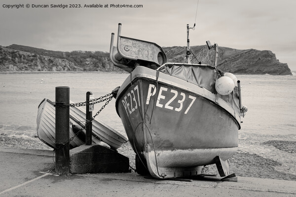Fishing Boat at Lulworth Cove black and white Picture Board by Duncan Savidge