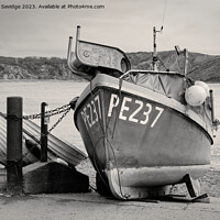 Buy canvas prints of Fishing Boat at Lulworth Cove black and white by Duncan Savidge