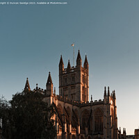 Buy canvas prints of Bath Abbey low key golden hour by Duncan Savidge