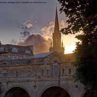 Buy canvas prints of Setting sun behind Pulteney Bridge Bath by Duncan Savidge