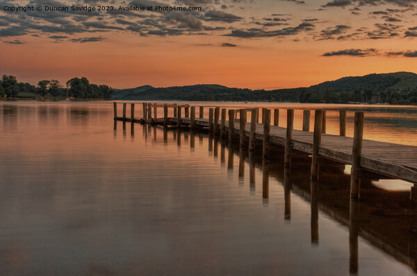 Coniston jetty wam susnet - the lake district Picture Board by Duncan Savidge