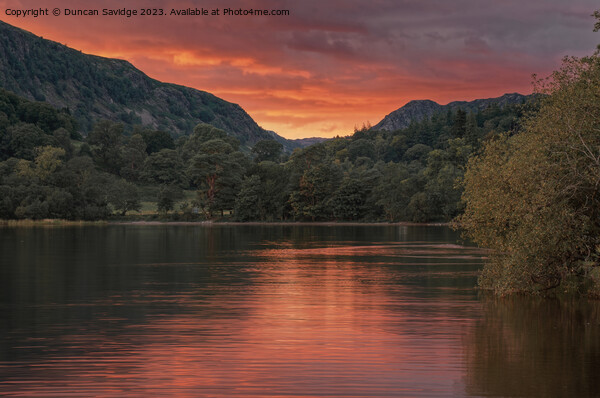Firery sunset over the Eastern shore of lake Coniston  Picture Board by Duncan Savidge