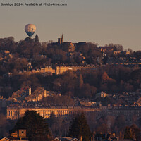 Buy canvas prints of Hot air balloon floats over the golden Royal Crescent in winter  by Duncan Savidge