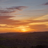 Buy canvas prints of Portrait of the winter sunset over Englishcombe  by Duncan Savidge