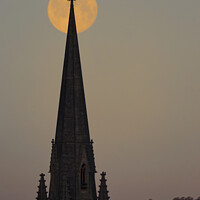 Buy canvas prints of Wolf moon church spire  by Duncan Savidge