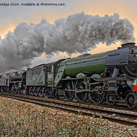 Buy canvas prints of Flying Scotsman steam train trackside moody by Duncan Savidge