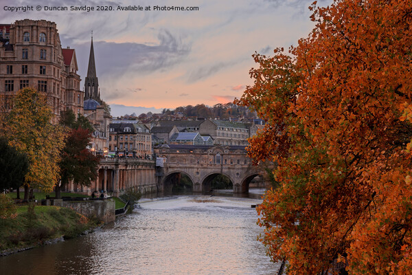 Beautiful Autumn Colours at the end of the day at Pulteney Weir Bath Picture Board by Duncan Savidge