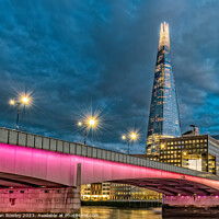 Buy canvas prints of The Shard & London Bridge at blue hour by Adrian Rowley
