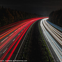 Buy canvas prints of Light Trails on the M25 by Adrian Rowley