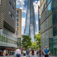 Buy canvas prints of City Life under The Shard by Adrian Rowley