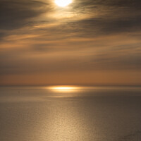 Buy canvas prints of Moody sunrise in Looe Bay by Jim Peters
