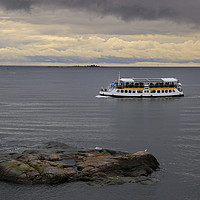Buy canvas prints of Small Ferry on Moody Sea by Taina Sohlman