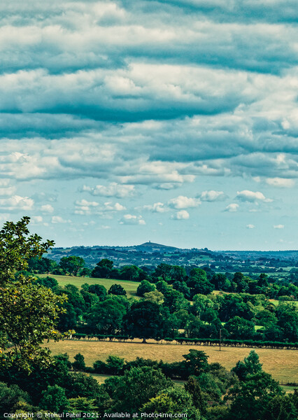 View of Glastonbury Tor in the distance and its surrounding countryside from summit of Cheddar Gorge Picture Board by Mehul Patel
