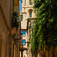 Buy canvas prints of Santa Tecla street leading to the side of the cathedral in Tarragona by Mehul Patel