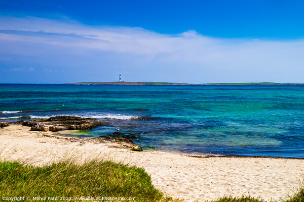 Deserted sandy beach at Punta Prima looking out to lighthouse on Picture Board by Mehul Patel