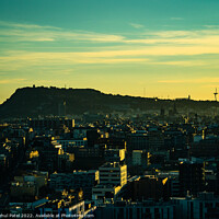 Buy canvas prints of Barcelona evening cityscape at sunset with Montjuic in silhouette, Catalonia, Spain by Mehul Patel