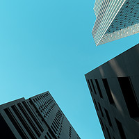 Buy canvas prints of Tall skyscrapers against clear turquoise sky  by Mehul Patel