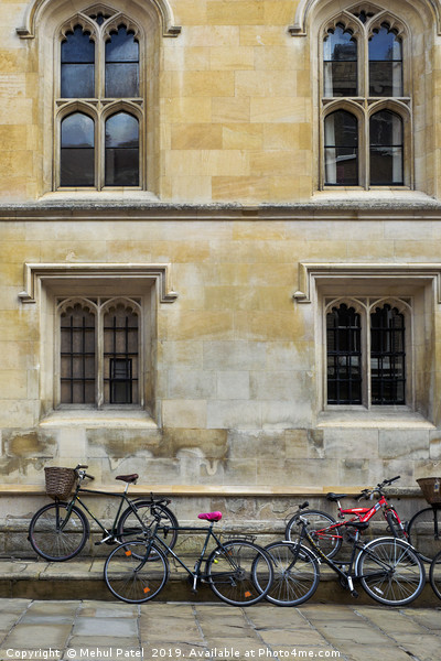 Bicycles parked along the pavement in Cambridge Picture Board by Mehul Patel
