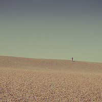 Buy canvas prints of Person walking up Chesil beach, Dorset, England, U by Mehul Patel