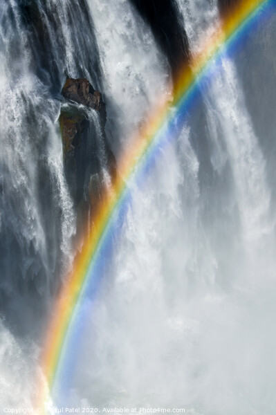 Rainbow amongst the mist, spray and cascading water of Victoria Falls, Africa Picture Board by Mehul Patel
