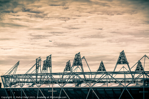 Airplane flying over the 2012 Olympic Stadium in Stratford, London, England, UK Picture Board by Mehul Patel