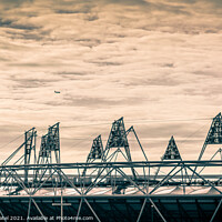 Buy canvas prints of Airplane flying over the 2012 Olympic Stadium in Stratford, London, England, UK by Mehul Patel