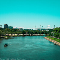 Buy canvas prints of Split toned image of the Yarra river with the Melbourne Cricket Ground in the distance. Digital paintbrush effect applied to image. by Mehul Patel
