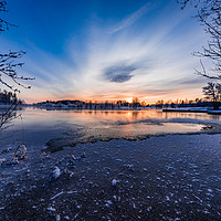 Buy canvas prints of beautiful sunset over a cold lake in Sweden by Jonas Rönnbro