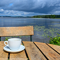 Buy canvas prints of coffee cup on wooden table near lake by Jonas Rönnbro